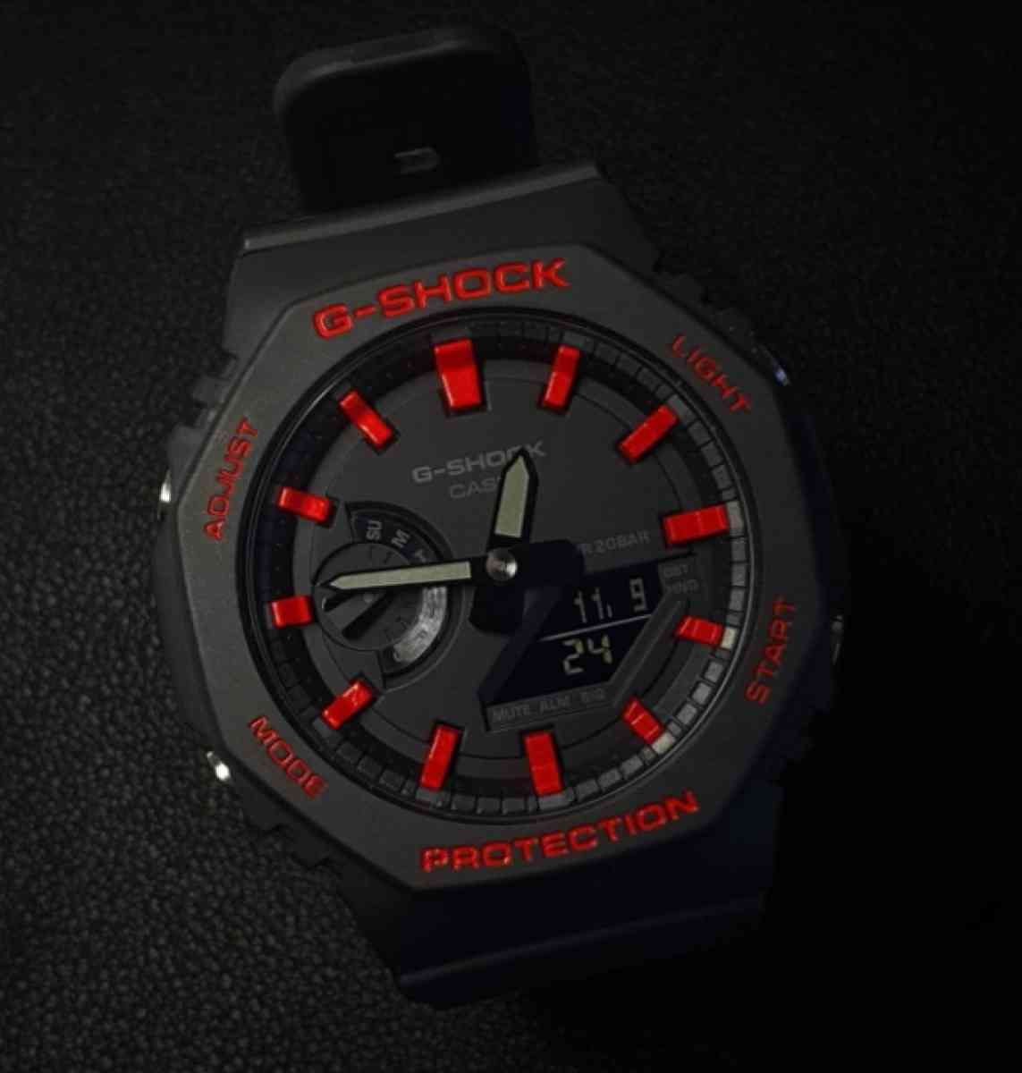 PreviousNextMontre Casio GShock Noir fond noir et rouge
